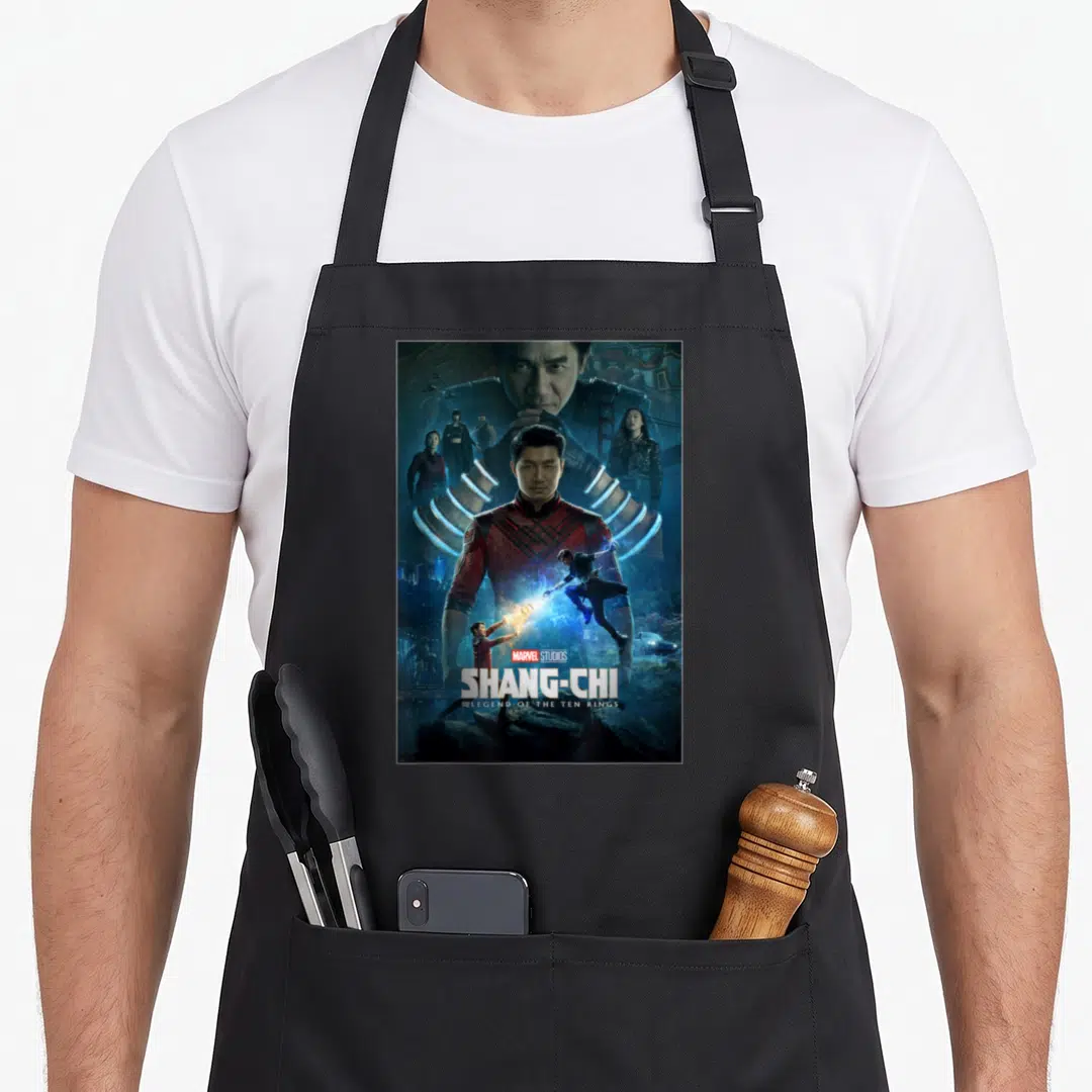 Shang movie poster apron - Shang-Chi movie poster with blue rings, stacked text, and character collage — shown on a black cotton canvas apron against a white background