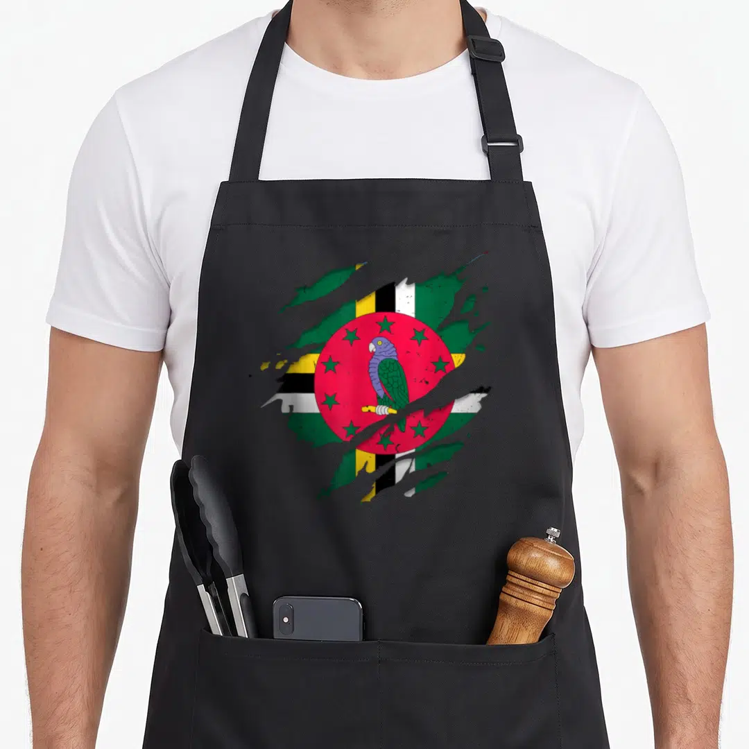 Dominican torn apron - Realistic flag with parrot and stars tearing through grey surface in green red yellow and black — shown on a black cotton canvas apron against a white background