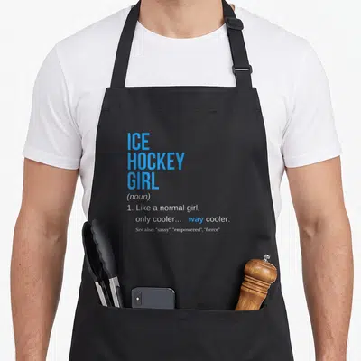 Hockey sassy apron - Blue and white typography defining Ice Hockey Girl as a noun meaning way cooler — shown on a black cotton canvas apron against a white background