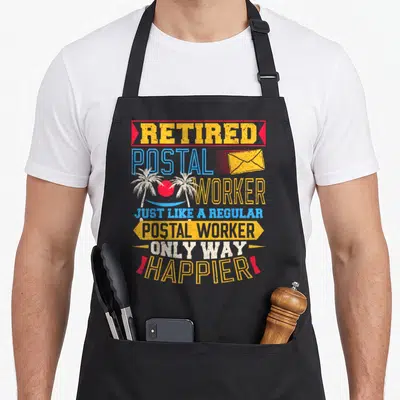 Retired postal mailman retirement apron - Retro text reading Retired Postal Worker with envelope and palm tree beach — shown on a black cotton canvas apron against a white background