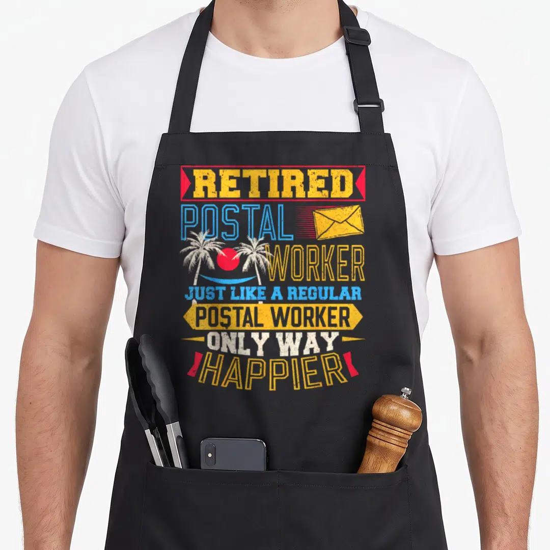 Retired postal mailman retirement apron - Retro text reading Retired Postal Worker with envelope and palm tree beach — shown on a black cotton canvas apron against a white background