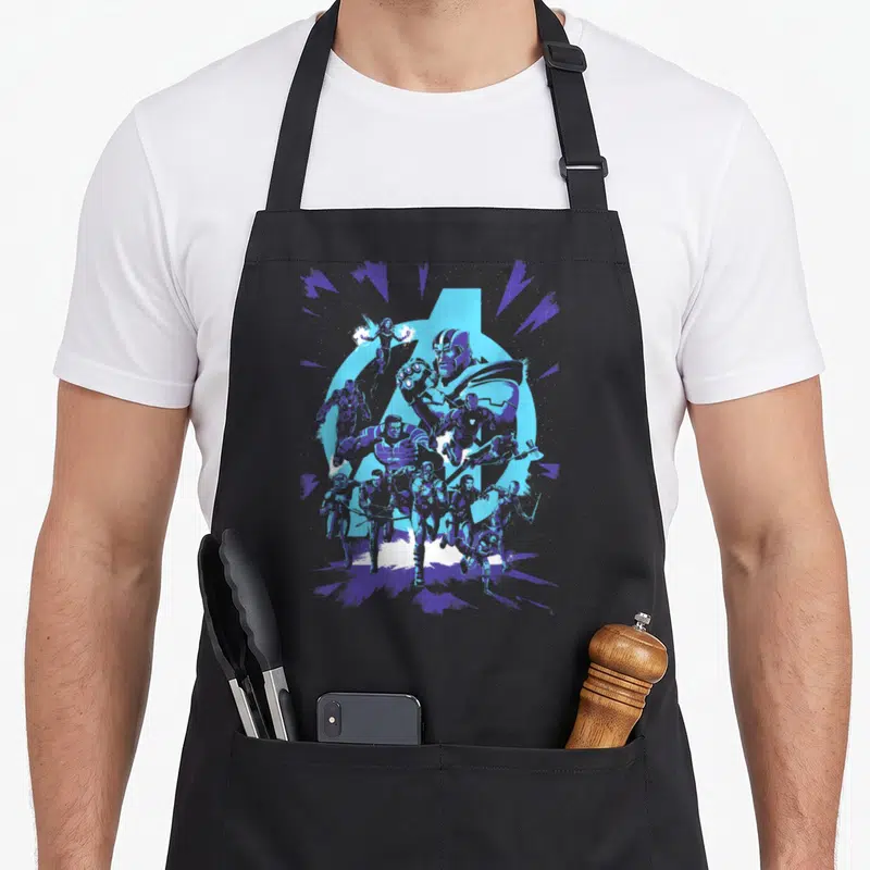 Funny endgame heroe apron - Thanos and superhero cluster in blue cartoon art before a large circle and radiating lines — shown on a black cotton canvas apron against a white background