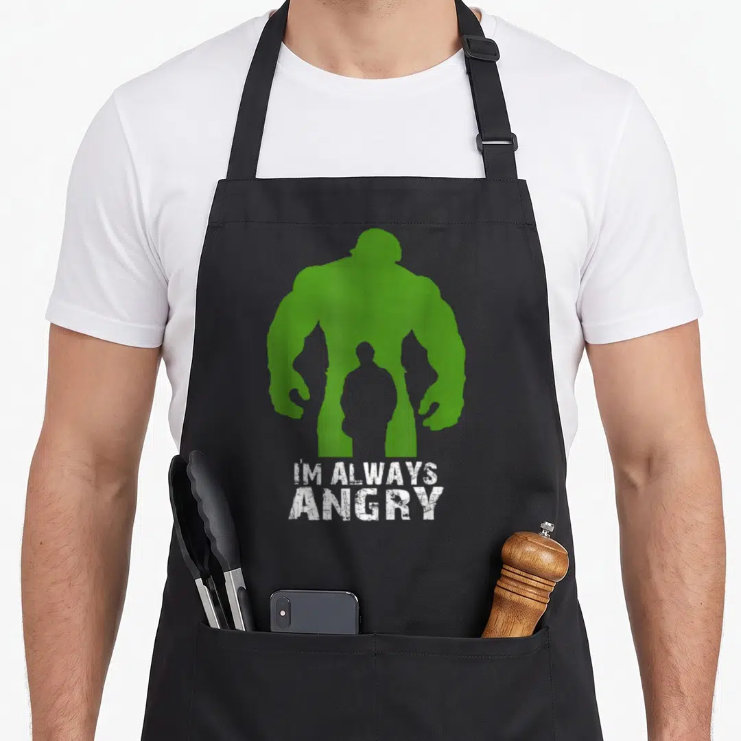 Macho urban apron - Green Hulk silhouette with grey human inside and white I'M ALWAYS ANGRY text — shown on a black cotton canvas apron against a white background