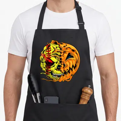 Softball halloween apron - Cartoon pumpkin skull hybrid with red stitching and orange melting details — shown on a black cotton canvas apron against a white background