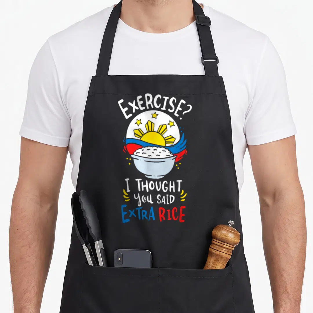 Philippine dirty rice apron - Bowl of rice with Philippine flag sun stars and Exercise I thought you said extra rice — shown on a black cotton canvas apron against a white background