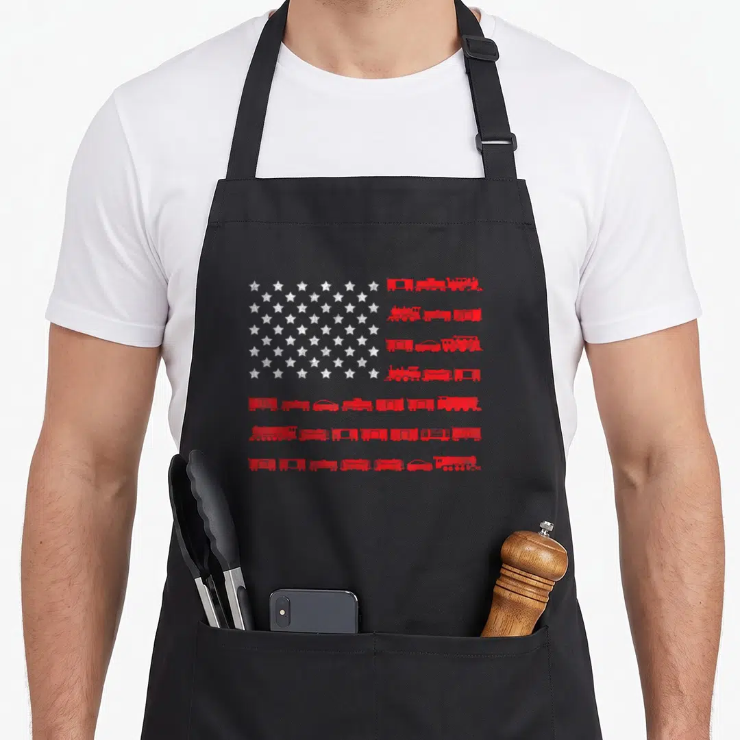 Railroad american flag apron - Distressed USA flag design with red train car stripes and white stars — shown on a black cotton canvas apron against a white background