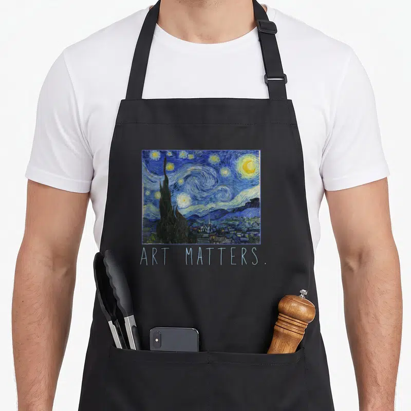 Matter van gogh apron - Starry Night painting print with ART MATTERS text below — shown on a black cotton canvas apron against a white background