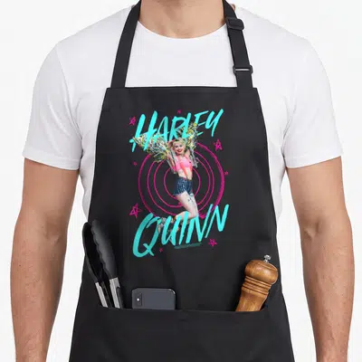 Prey bird apron - Harley Quinn photo over pink rings with cyan text and pink stars — shown on a black cotton canvas apron against a white background