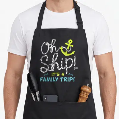 Trip cruise family aprons - White rope text Oh Ship around yellow anchor with blue waves — shown on a black cotton canvas apron against a white background