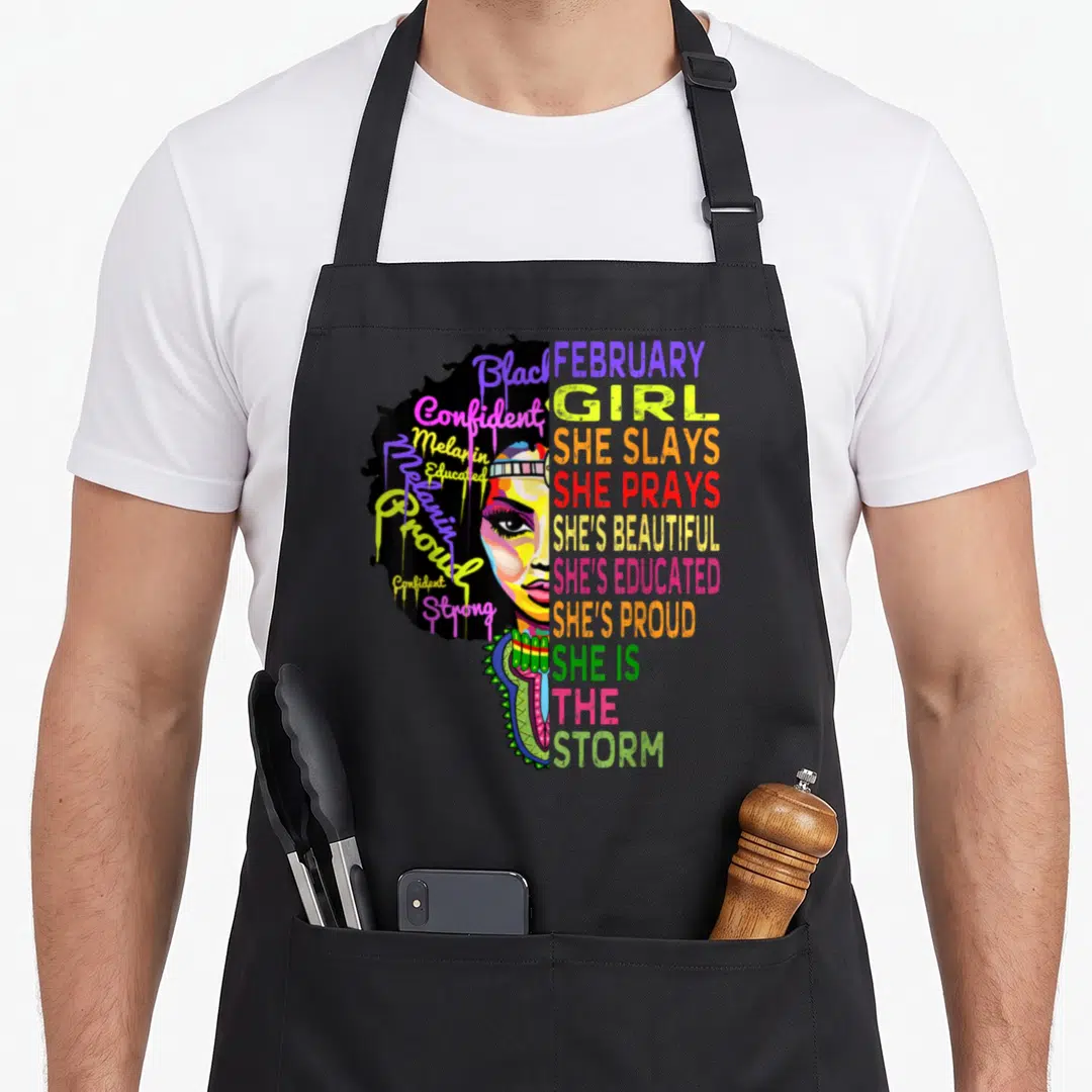 Magic african apron - Stylized woman portrait with Black Confident Melanin Educated Proud Strong text in yellow pink — shown on a black cotton canvas apron against a white background