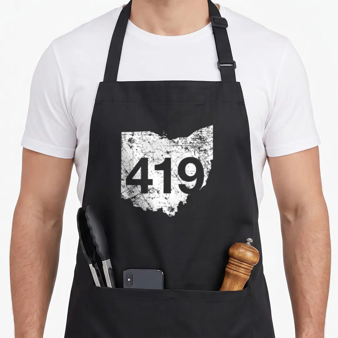 Toledo lima ohio apron - Distressed white Ohio map silhouette with grey 419 area code number printed on front — shown on a black cotton canvas apron against a white background