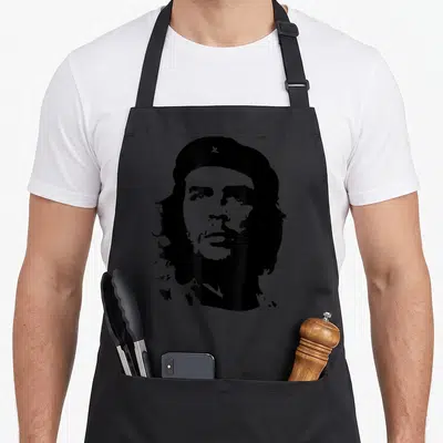 Che cuban boy apron - Black and white line art portrait of Che Guevara wearing a beret with a star — shown on a black cotton canvas apron against a white background