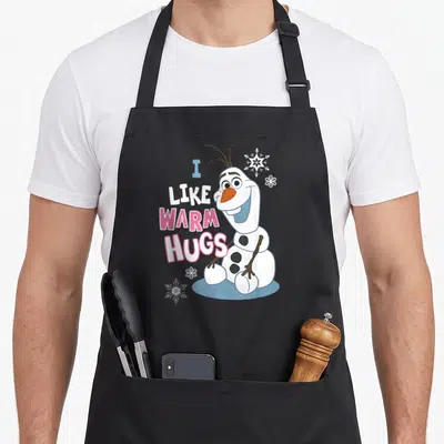 Frozen olaf christmas apron - Olaf snowman with I LIKE WARM HUGS text and three snowflakes in pink and blue — shown on a black cotton canvas apron against a white background