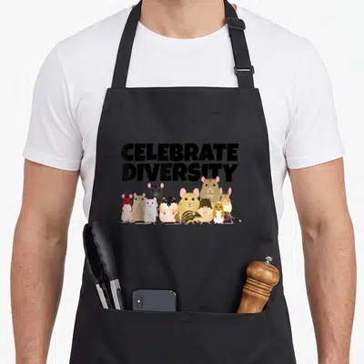 Celebrate gerbil lover apron - CELEBRATE DIVERSITY text above cartoon rodents in black, brown, tan, and white — shown on a black cotton canvas apron against a white background
