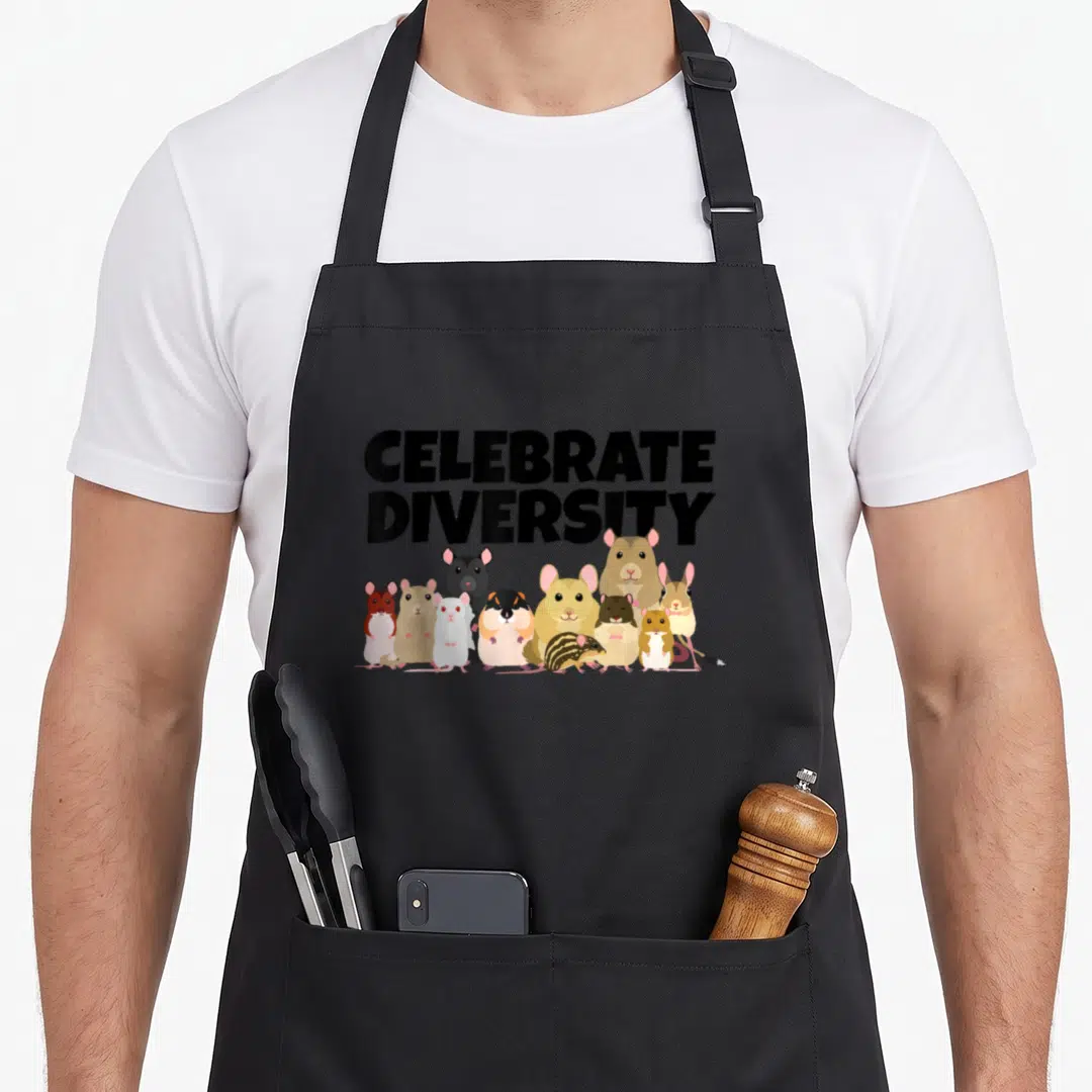 Celebrate gerbil lover apron - CELEBRATE DIVERSITY text above cartoon rodents in black, brown, tan, and white — shown on a black cotton canvas apron against a white background
