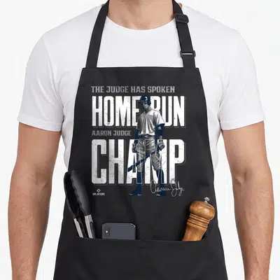 Run new york apron - Aaron Judge baseball player with distressed white text reading Home Run Champ and The Judge Has — shown on a black cotton canvas apron against a white background