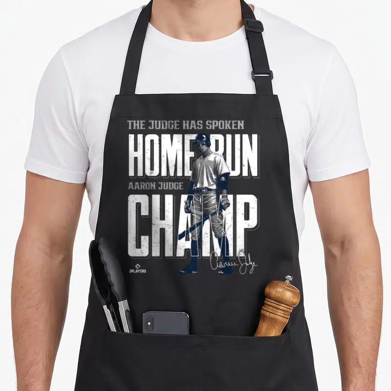 Run new york apron - Aaron Judge baseball player with distressed white text reading Home Run Champ and The Judge Has — shown on a black cotton canvas apron against a white background