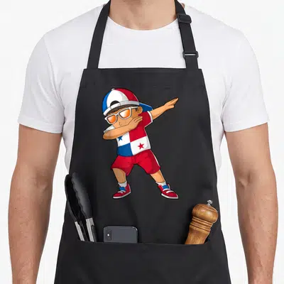 Panama heritage aprons - Cartoon boy dabbing in red white blue outfit with flag shirt and orange sunglasses — shown on a black cotton canvas apron against a white background
