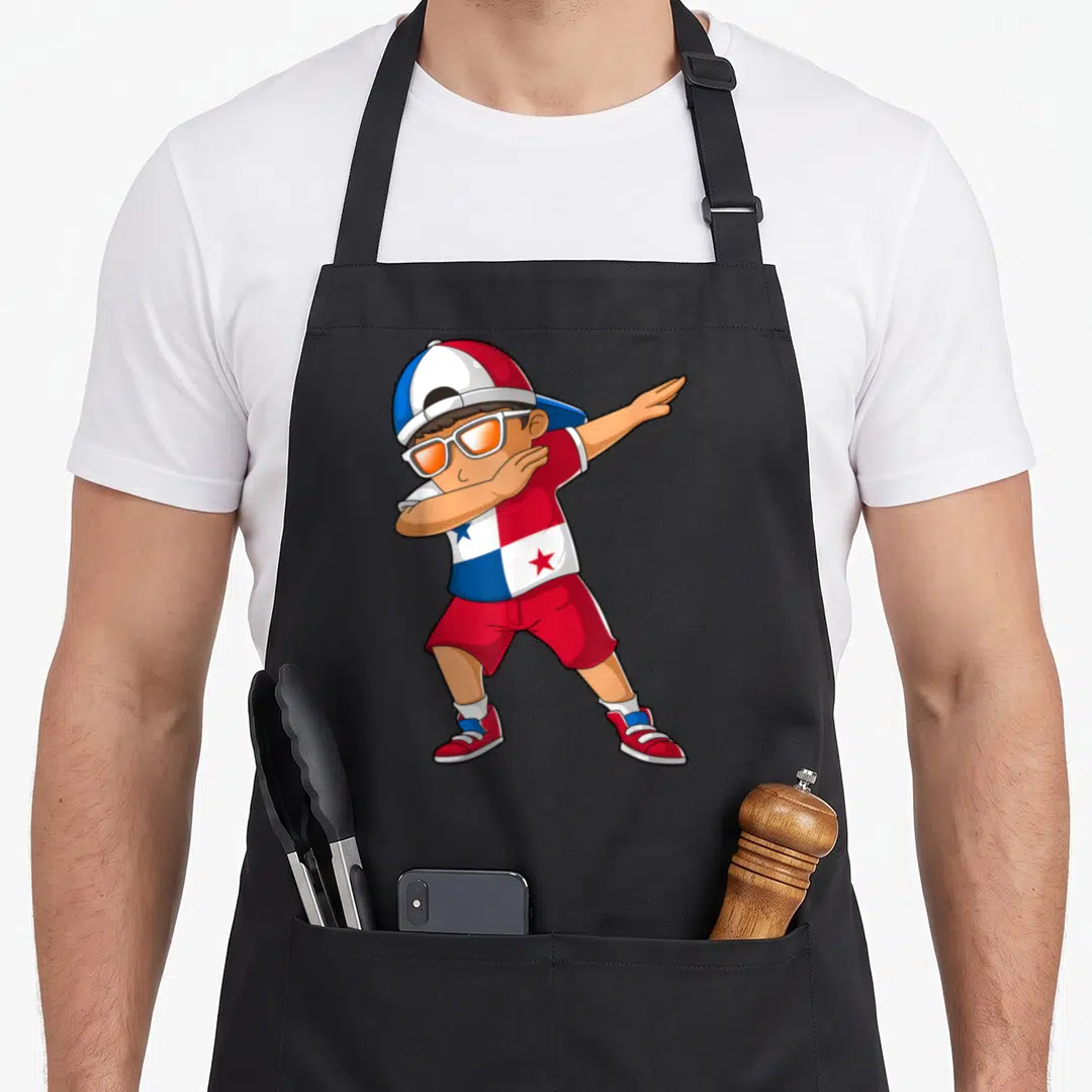 Panama heritage aprons - Cartoon boy dabbing in red white blue outfit with flag shirt and orange sunglasses — shown on a black cotton canvas apron against a white background