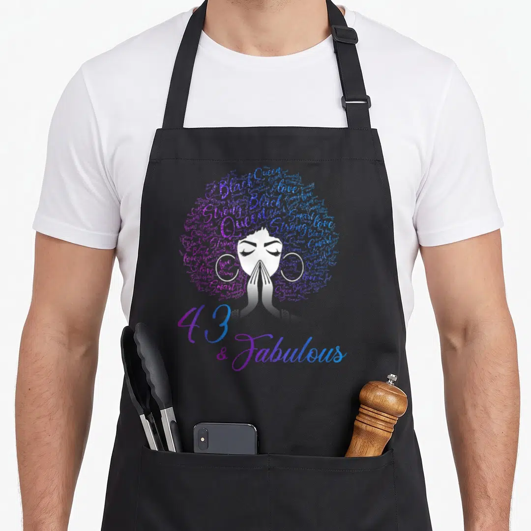 43rd hair apron - Woman with afro made of purple blue words and 43 & Fabulous text — shown on a black cotton canvas apron against a white background
