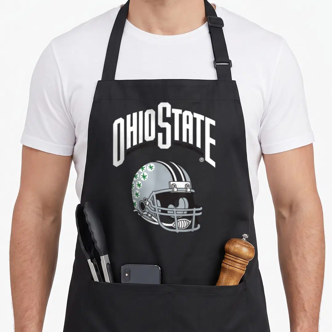 Helmet canton ohio apron - Arched OHIO STATE text above grey helmet with green circular icons — shown on a black cotton canvas apron against a white background