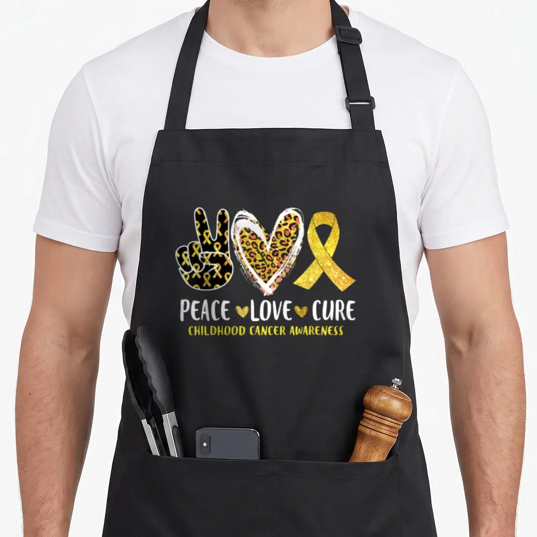 Peace childhood cancer awareness apron - Peace sign, leopard heart, and gold ribbon with stacked text reading Peace — shown on a black cotton canvas apron against a white background