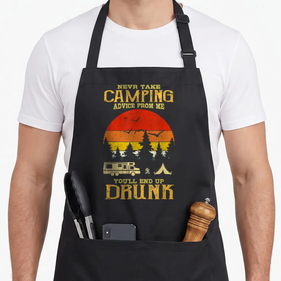 Drunk camping apron - Retro sun graphic with camper tent fire and text never take camping advice from me you'll end up — shown on a black cotton canvas apron against a white background