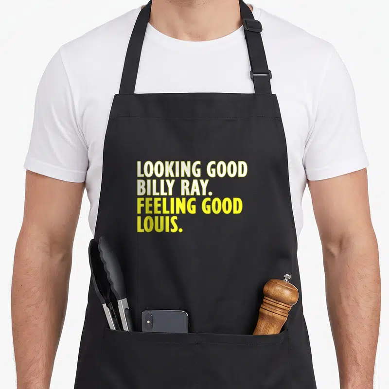 Ray billy apron - Yellow stacked text reading Looking Good Billy Ray Feeling Good Louis — shown on a black cotton canvas apron against a white background