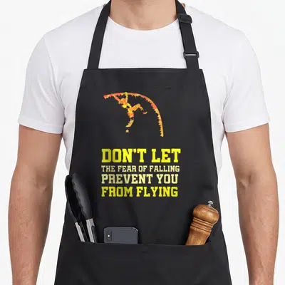 Pole vaulting track apron - Distressed parachuter silhouette in orange and red above yellow stacked motivational text — shown on a black cotton canvas apron against a white background
