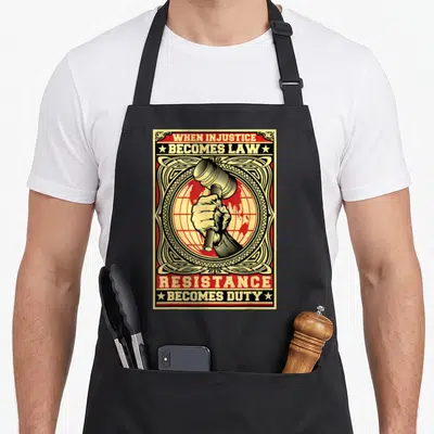 Injustice best law ever apron - Hand holding gavel over red globe with banners reading When Injustice Becomes Law — shown on a black cotton canvas apron against a white background