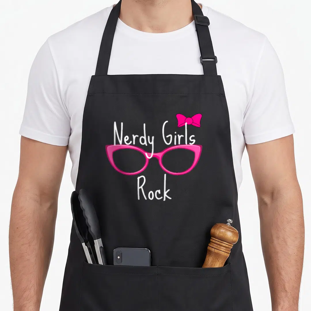 Nerdy geek aprons - Pink glasses with a bow and white Nerdy Girls Rock text — shown on a black cotton canvas apron against a white background