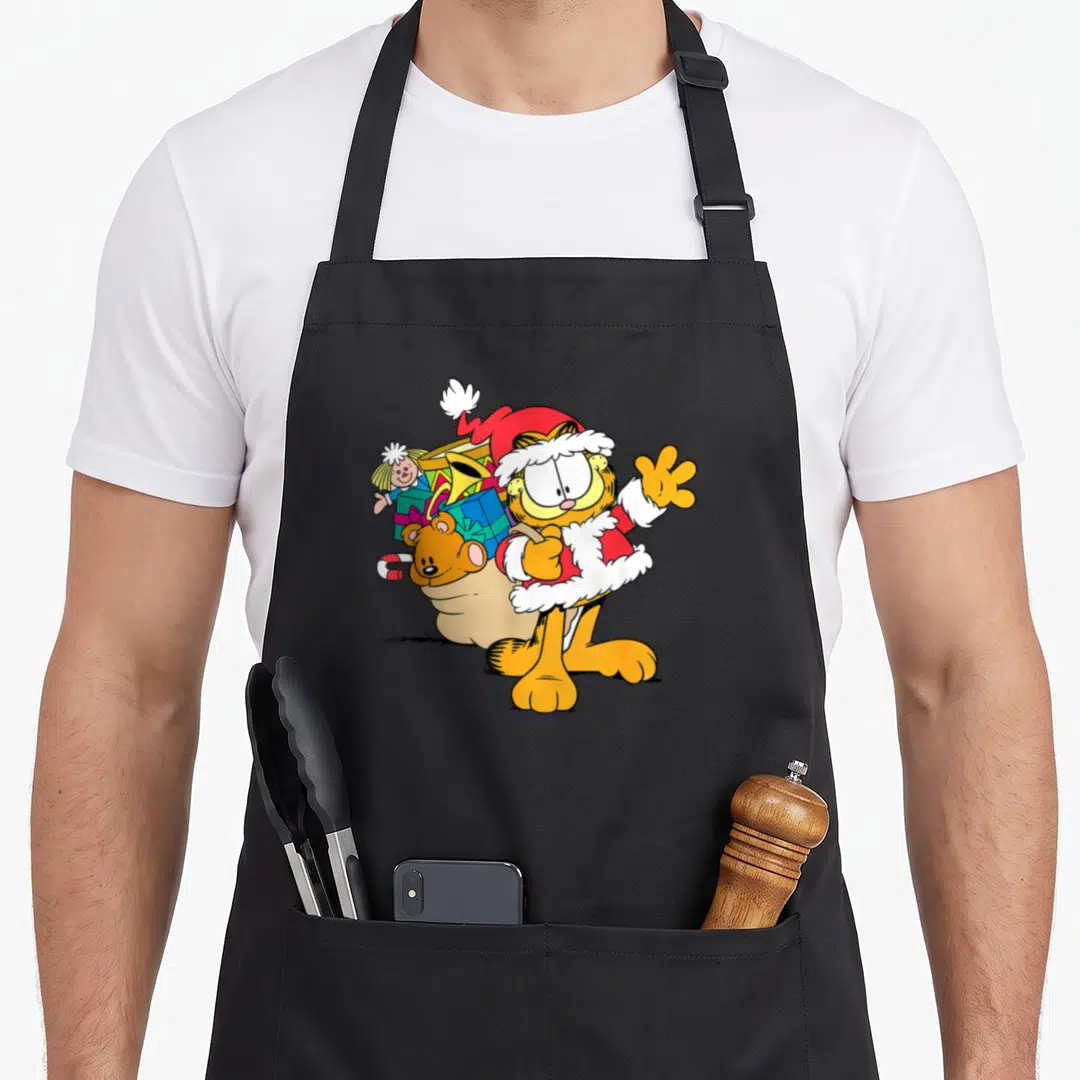 Cartoon christmas santa apron - Orange cartoon cat in red Santa suit waving with beige toy sack on back — shown on a black cotton canvas apron against a white background
