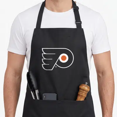 Flyer philadelphia apron - White wing P logo with orange circle on black bib — shown on a black cotton canvas apron against a white background