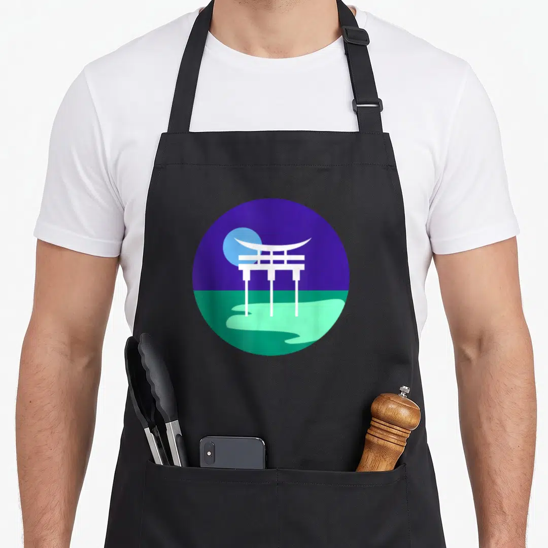 Vincian gay pride apron - White torii gate in a circle with purple sky and green ground — shown on a black cotton canvas apron against a white background