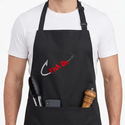 Joke fish apron - Red Fish On text on silver hook with grey background — shown on a black cotton canvas apron against a white background