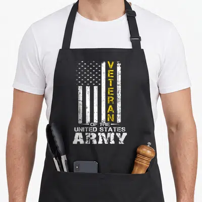State us aprons - Distressed USA flag with vertical yellow VETERAN text and white stacked ARMY lettering — shown on a black cotton canvas apron against a white background