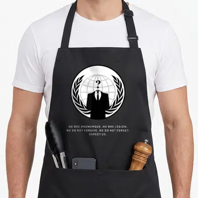 Culture hacker apron - Anonymous figure suit question mark globe laurel wreath manifesto text three lines — shown on a black cotton canvas apron against a white background