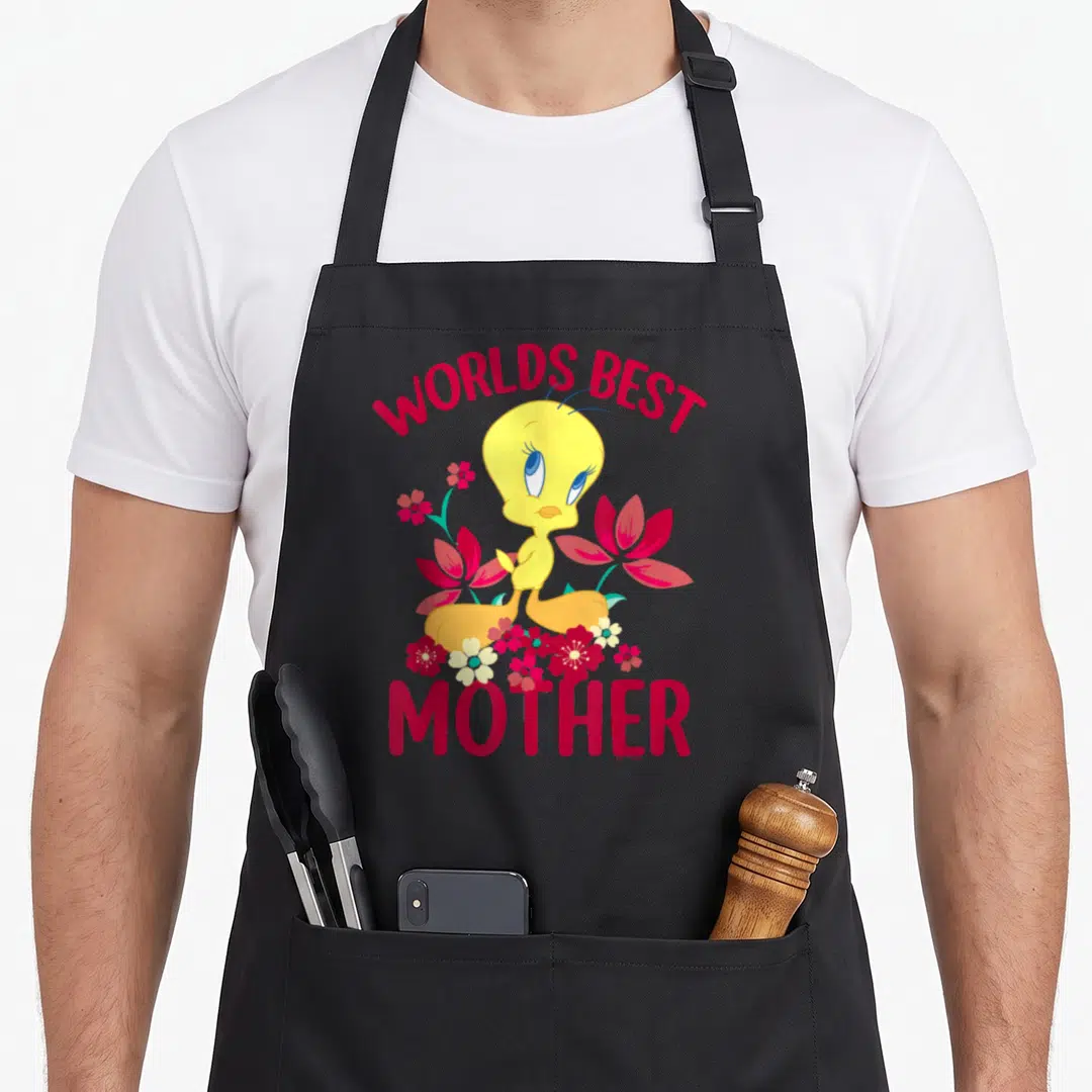 Tweety mother's day aprons - Yellow Tweety Bird surrounded by red and teal flowers with red WORLDS BEST MOTHER text — shown on a black cotton canvas apron against a white background