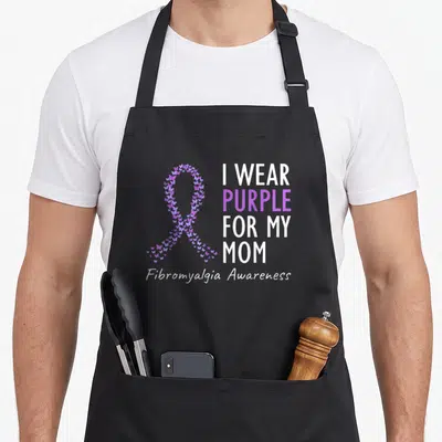 Fibromyalgia awareness ribbon apron - Purple butterfly ribbon and I Wear Purple For My Mom text — shown on a black cotton canvas apron against a white background