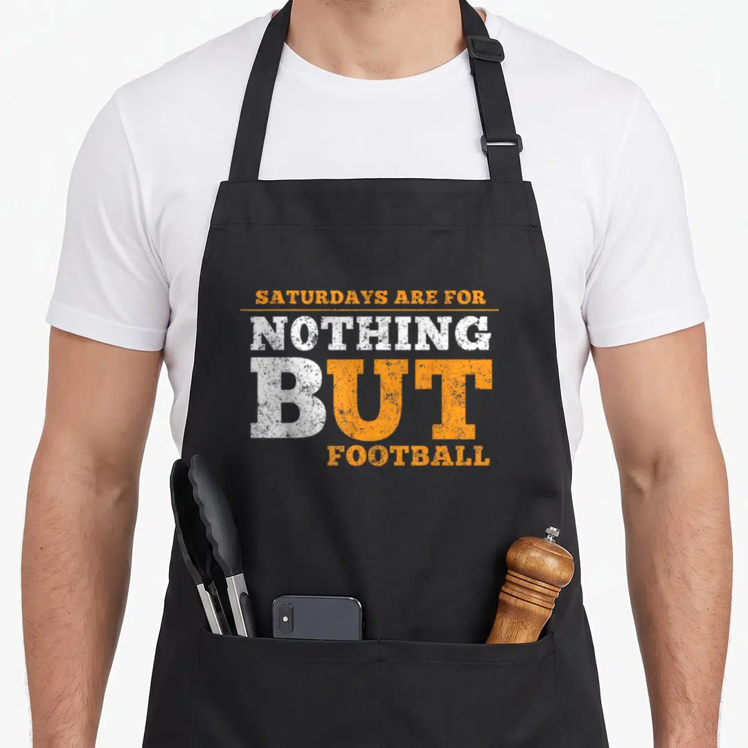 State knoxville apron - Orange and white stacked text reading SATURDAYS ARE FOR NOTHING BUT FOOTBALL — shown on a black cotton canvas apron against a white background