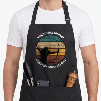 Archery traditional apron - Retro archer silhouette in circle with horizontal stripes and text TRADITIONAL ARCHERY — shown on a black cotton canvas apron against a white background