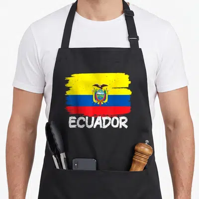 Funny flag ecuador apron - Distressed yellow blue red white flag above white ECUADOR text — shown on a black cotton canvas apron against a white background