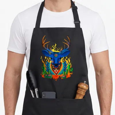 Third animal apron - Blue deer head with cacti, flames, and decorative collar in cartoon style — shown on a black cotton canvas apron against a white background