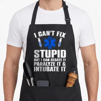 Paramedic ems emt apron - I Can't Fix Stupid text with blue Star of Life and two syringes — shown on a black cotton canvas apron against a white background