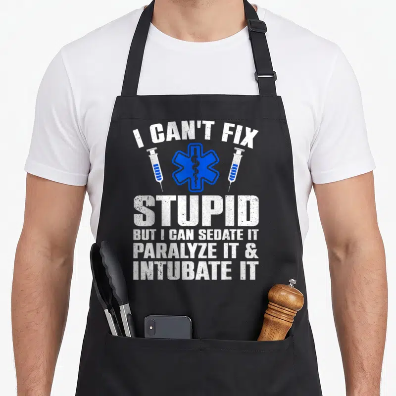 Paramedic ems emt apron - I Can't Fix Stupid text with blue Star of Life and two syringes — shown on a black cotton canvas apron against a white background