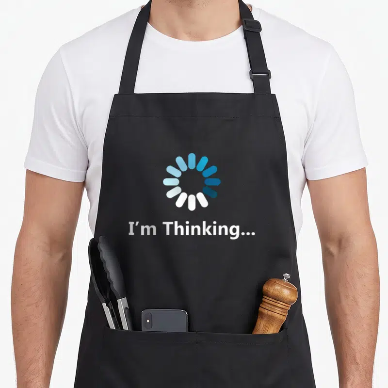 Sarcasm student humor apron - Blue loading circle above white text reading I'm Thinking on black fabric — shown on a black cotton canvas apron against a white background