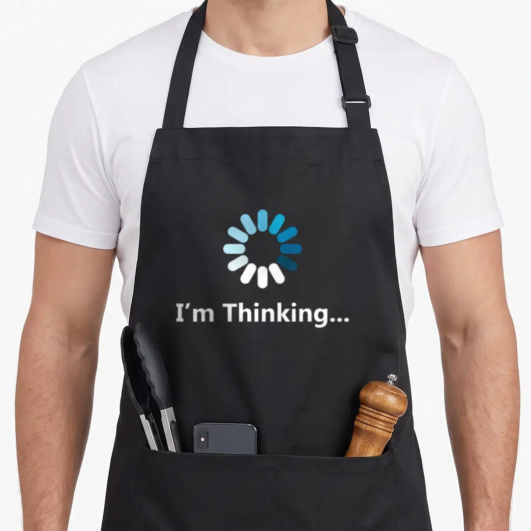 Sarcasm student humor apron - Blue loading circle above white text reading I'm Thinking on black fabric — shown on a black cotton canvas apron against a white background