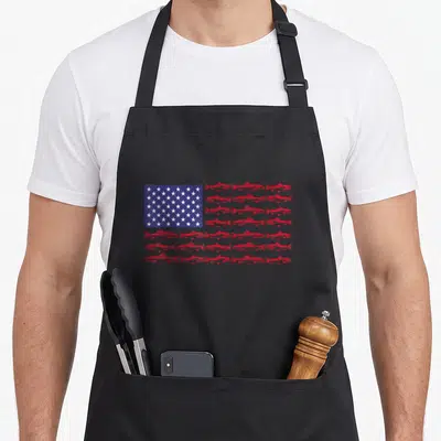 Largemouth american flag apron - Red fish arranged in rows forming stripes next to a blue rectangle with white stars — shown on a black cotton canvas apron against a white background