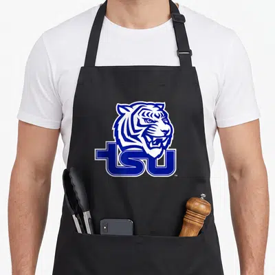 Tennessee state university apron - Blue and white cartoon tiger head above bold TSU letters — shown on a black cotton canvas apron against a white background