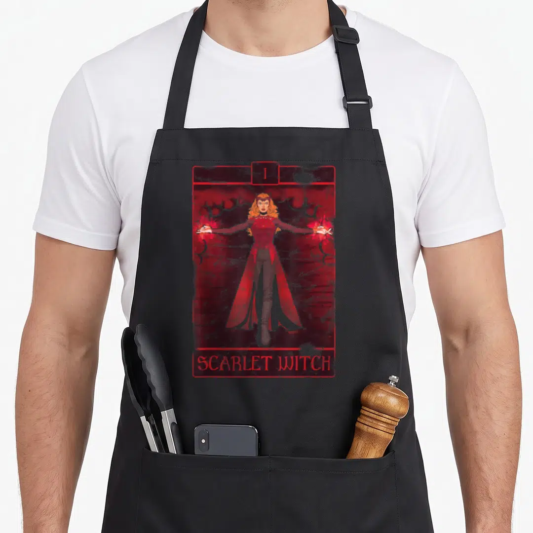 Witch doctor apron - Distressed red and black illustration of Scarlet Witch in a rectangular frame with Roman numeral I — shown on a black cotton canvas apron against a white background